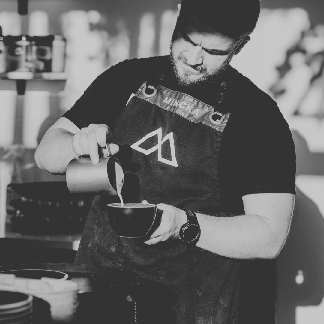 Cafe owner using premium wholesale coffee